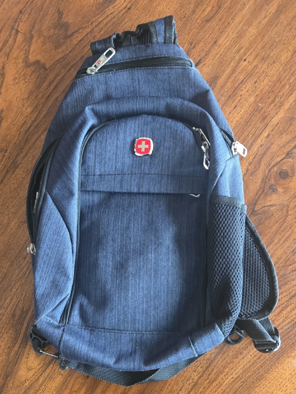 SwissGear Navy Sling Backpack with Red Emblem